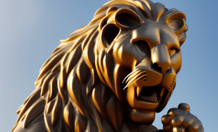 A low angle photo of a statue against a sky full of blue. The statue is of a lion with it's mouth open and it's teeth showing.